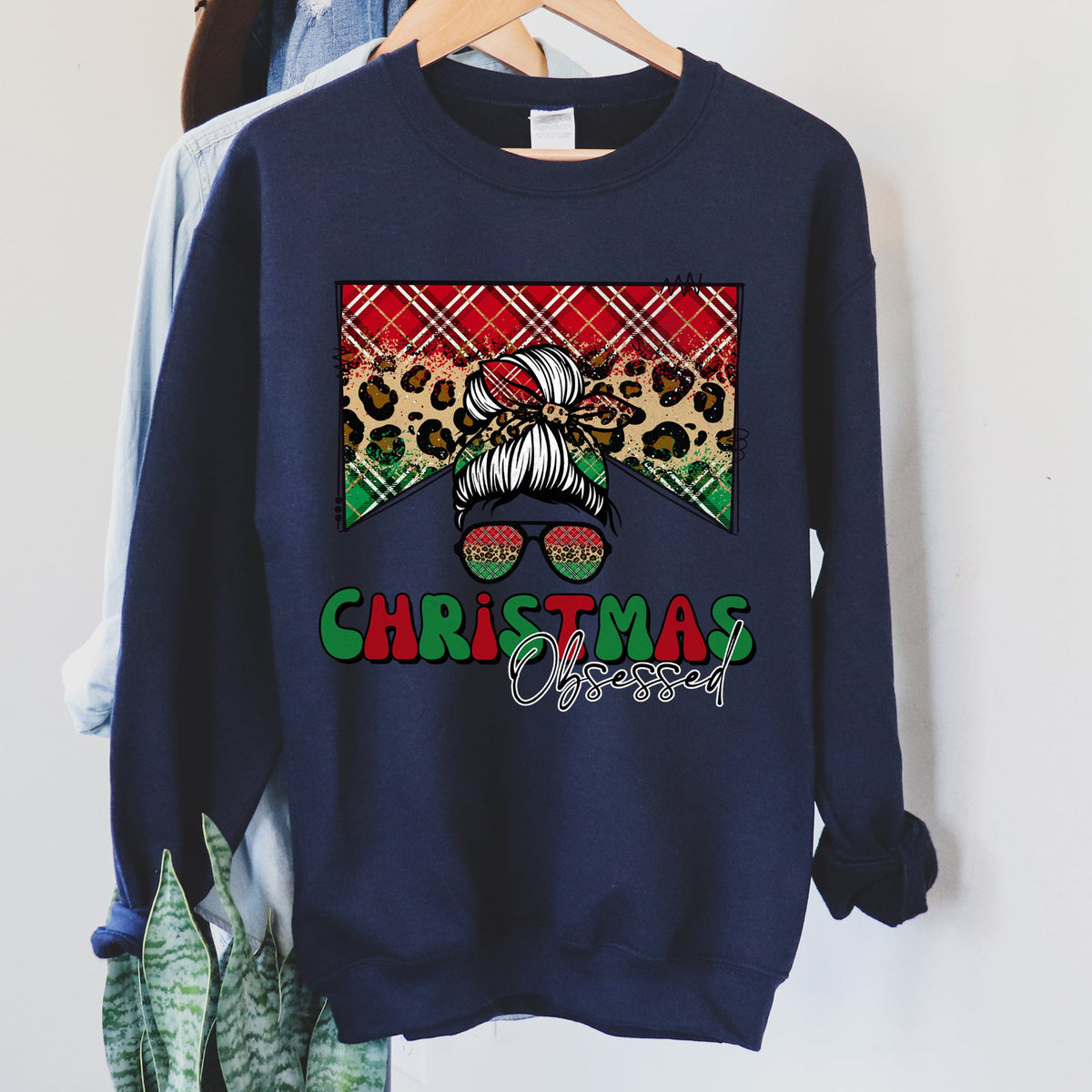 CHRISTMAS OBSESSED Leopard Print Messy Bun Mom Cozy Holiday Sweatshirt in 12 Colors S-2XL